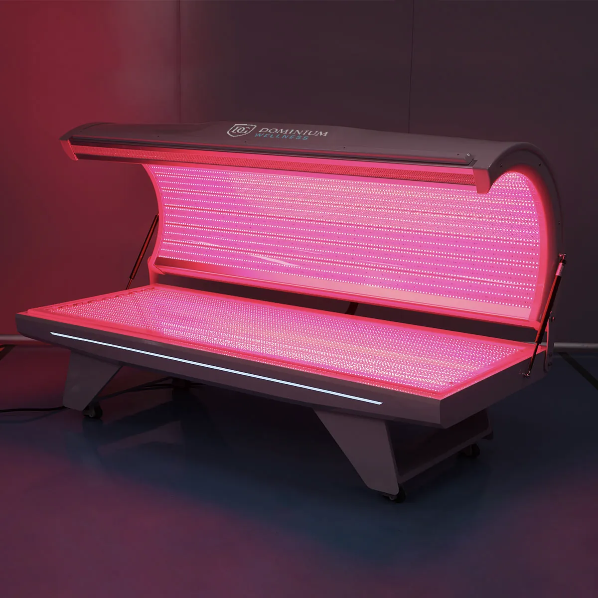 Dominium Wellness'ın DWRB Comfort model şık, yüksek teknolojili kırmızı ışık yatağının açık ve çalışır durumdaki yandan görünümü; modern dış tasarımı.